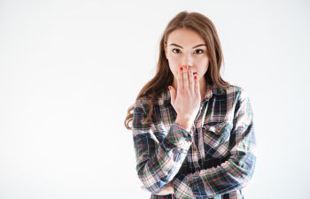 Woman Holding Hand Over Mouth Kennesaw GA