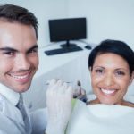 Woman in Dentist Chair Smiling AfterDental Procedures Kennesaw GA