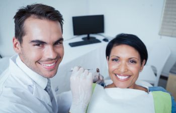 Woman in Dentist Chair Smiling AfterDental Procedures Kennesaw GA